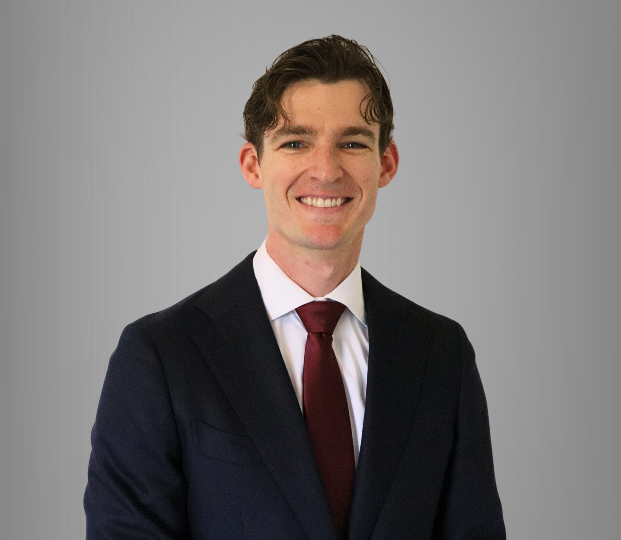 David Whann Jr., founder of Homeowner Insights, LLC, in a navy suit and dark red tie.